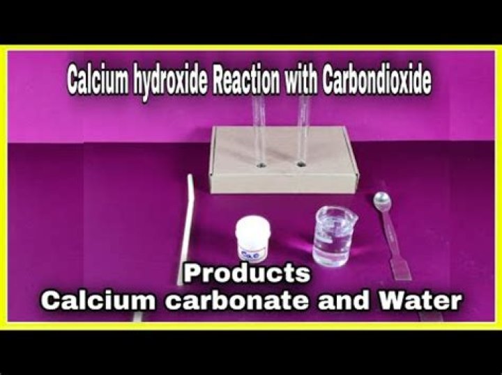 When calcium hydroxide reacts with carbon dioxide?