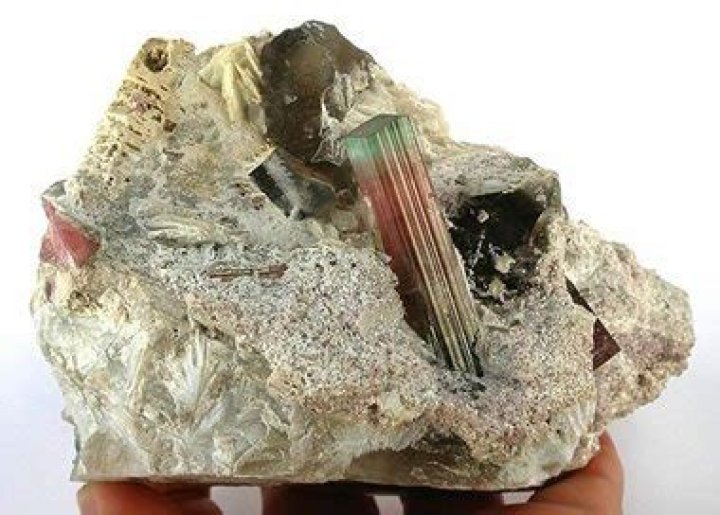 Why do pegmatites have large crystals?